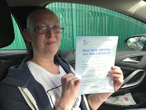 After driving lessons in Bury Lyndsey dispalys her pass certificate
