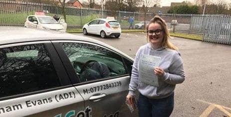 Niamh proudly shows off her driving test pass certificate