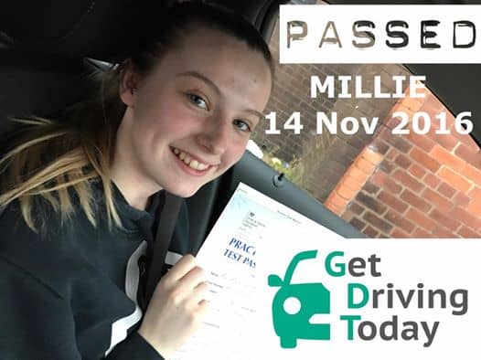 a proud millie displays her test certificate